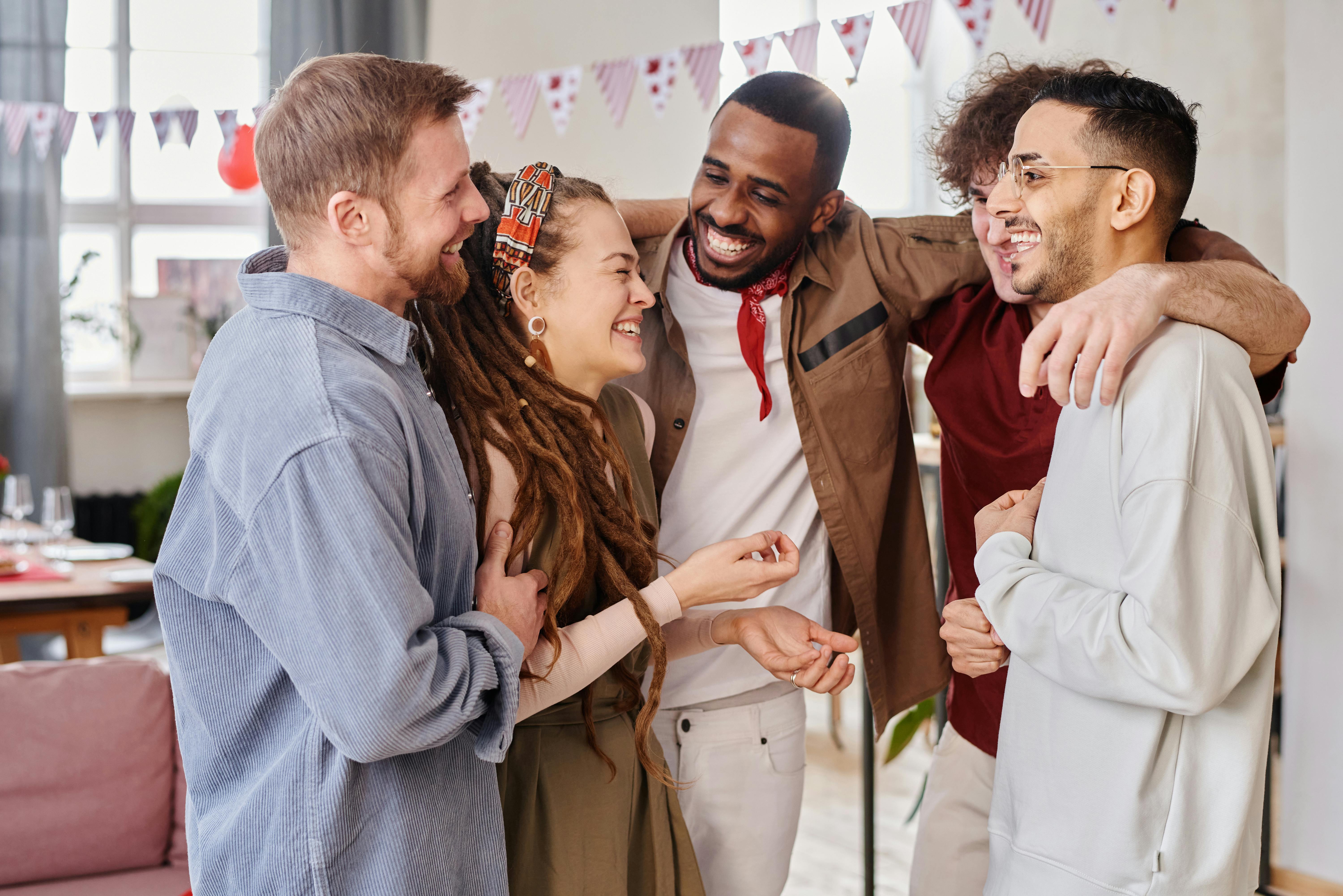 people hugging and laughing