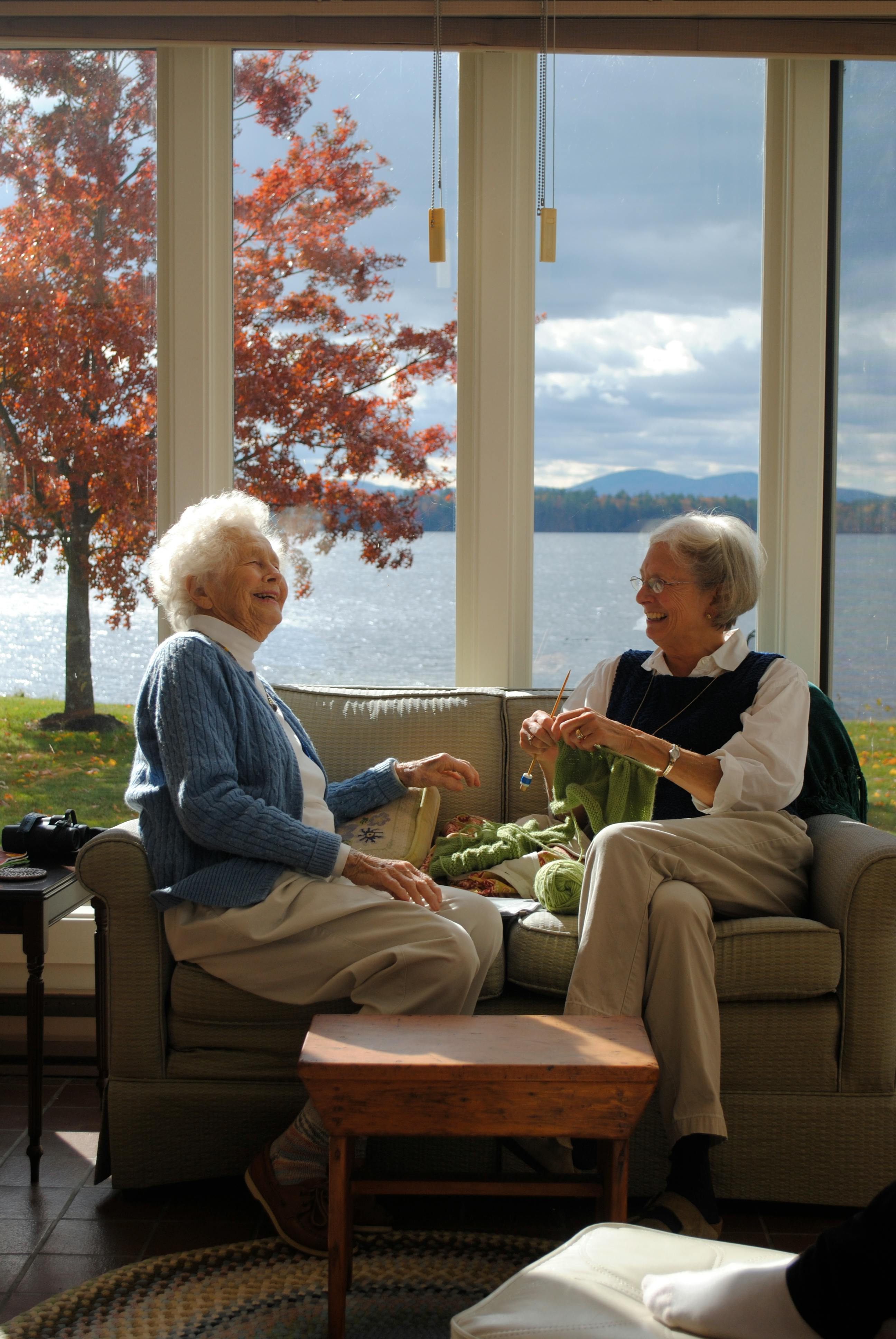 two people talking and laughing together