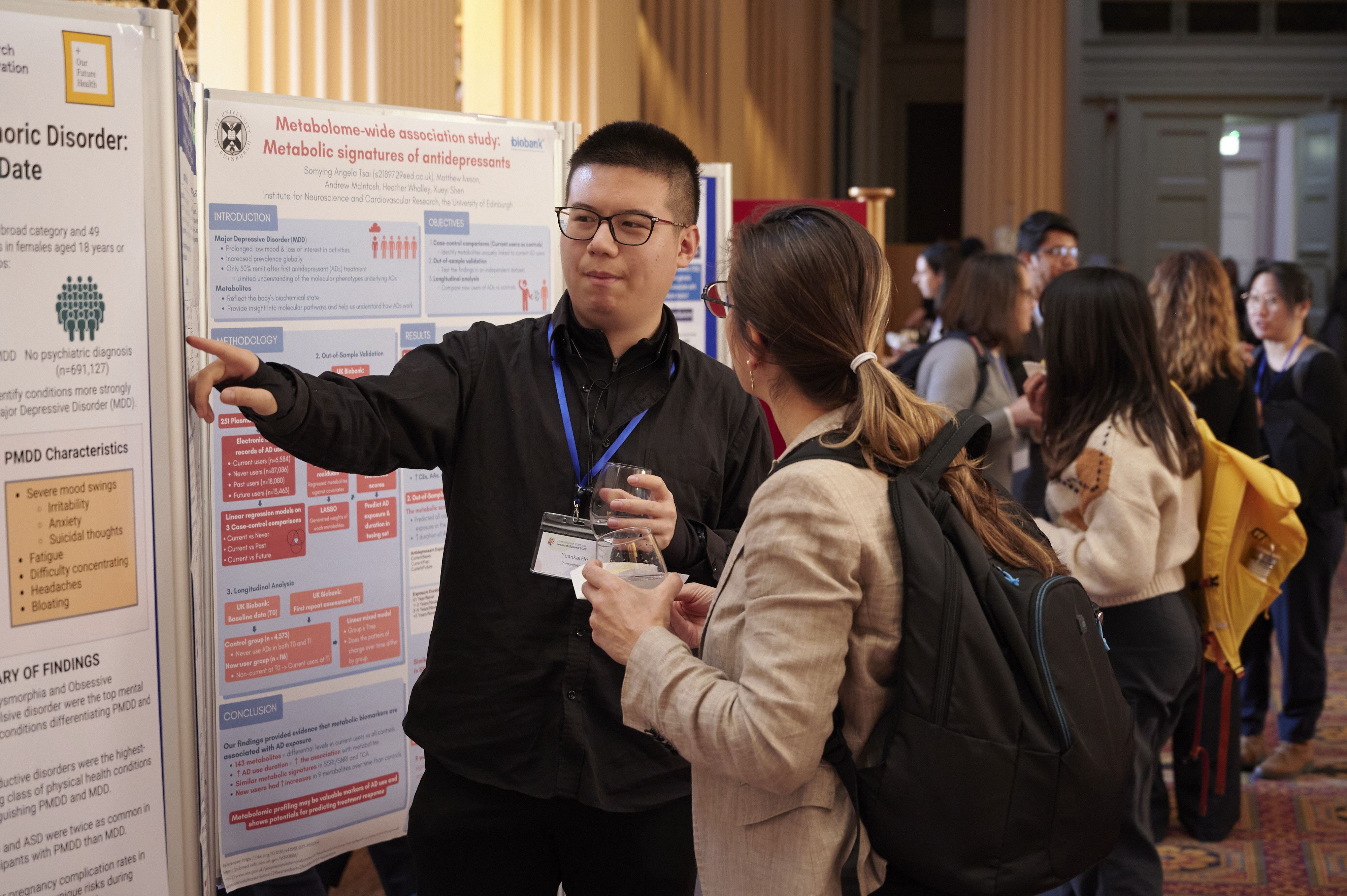 researchers talking at conference
