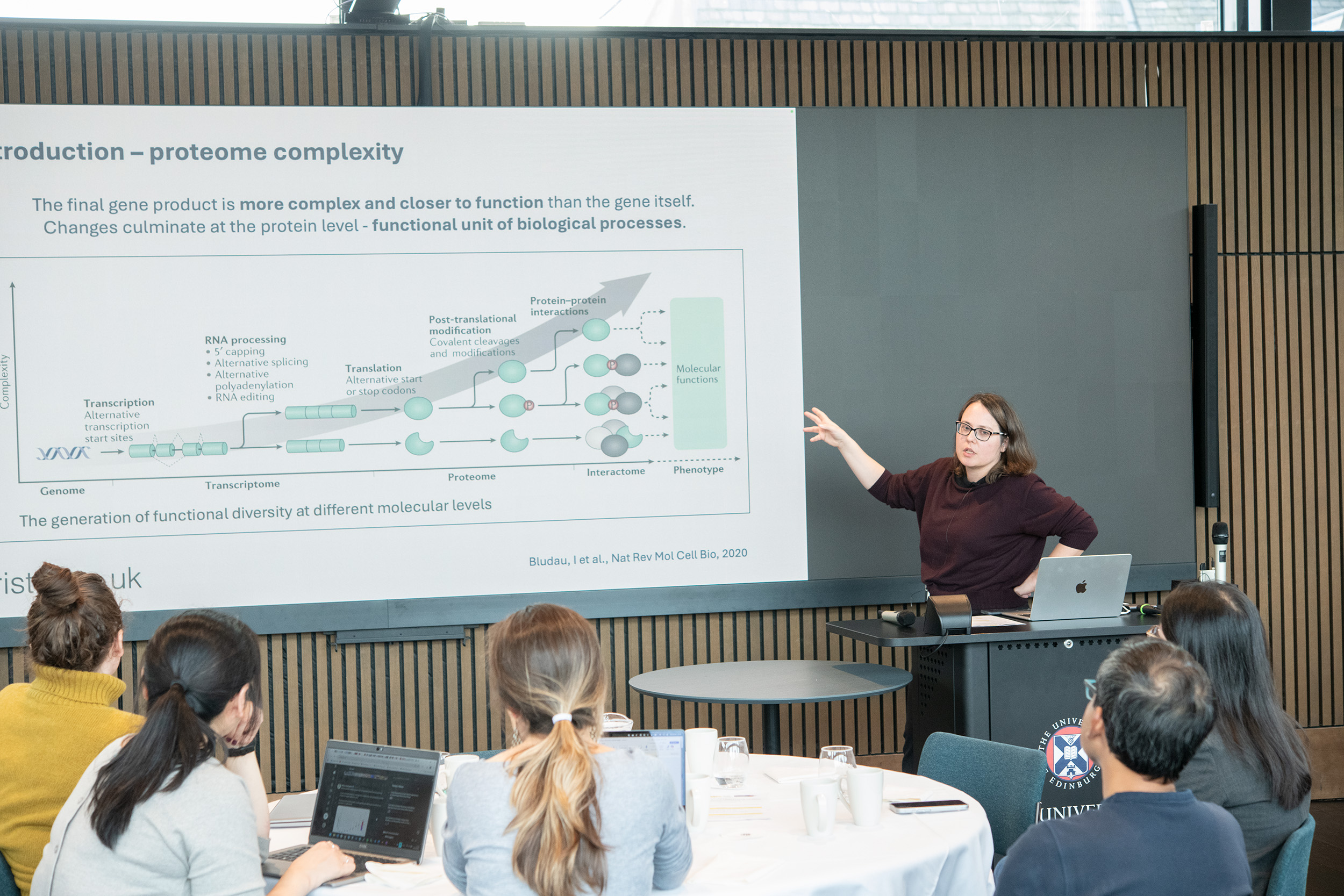 researcher presenting at podium
